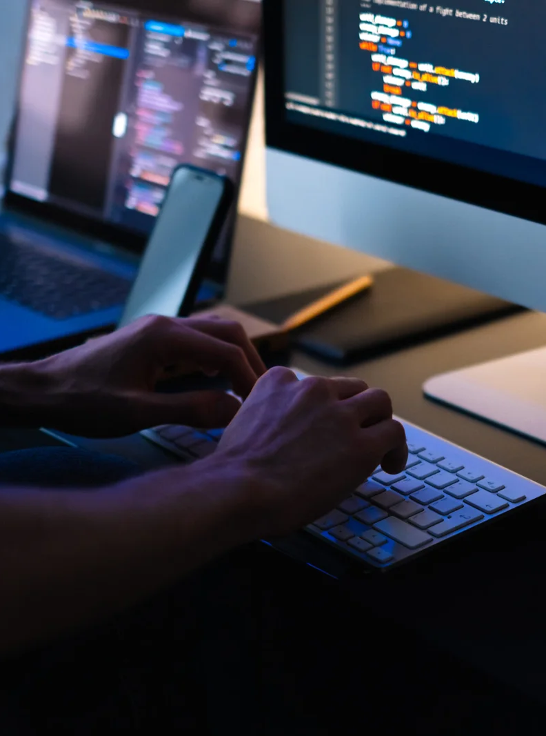 mobile-developer-writes-program-code-on-a-computer-2022-04-28-02-46-32-utc-scaled 1
